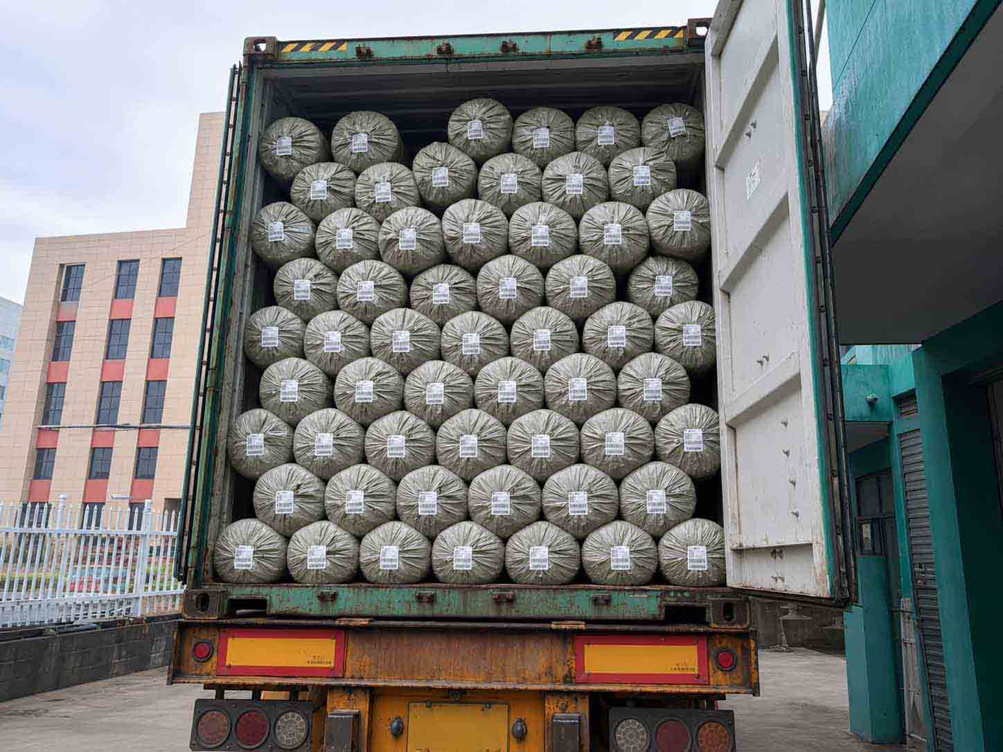 Bulk textile rolls loaded for international delivery